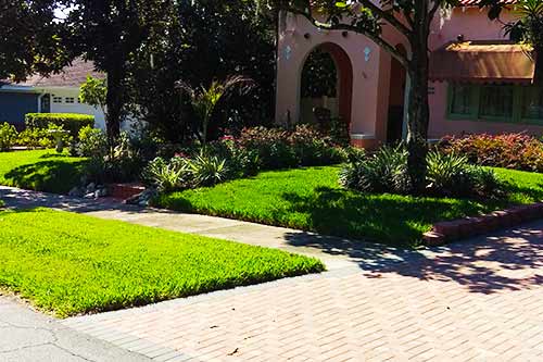 Lakeland home with a professionally mowed and maintained lawn.